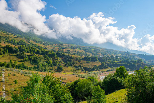 Symphonic Serenity: Green Mountains Compose a Melody with Blue Skies