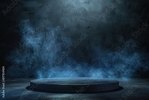 A dark room with a large, round, empty stage. The stage is surrounded by smoke, giving it a mysterious and eerie atmosphere