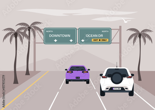 Two cars cruise under palm trees on a freeway, with directional signs pointing towards Downtown and Ocean Drive,The morning ambiance is calm with a soft sky and distant mountains