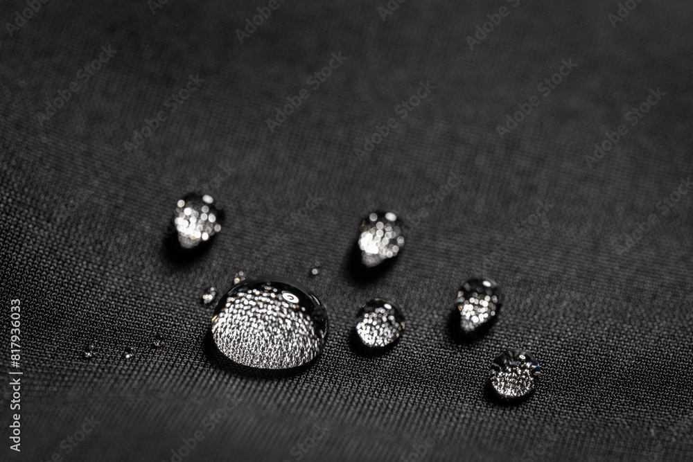 Many water drops on waterproof impregnated fabric Many water drops on waterproof impregnated fabric