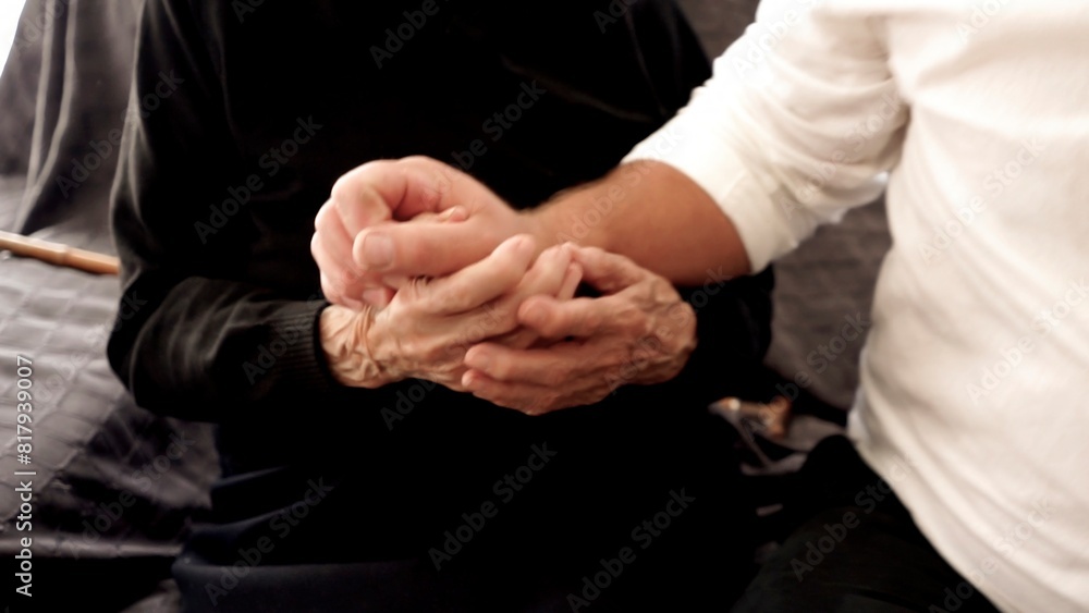 Hugs of an old hundred-year-old woman and the young hands of an adult son, symbolizing support, understanding and connection between generations, Close-up
