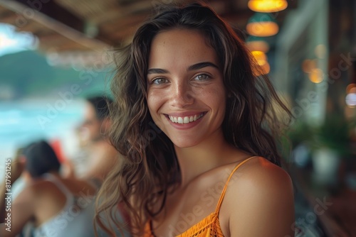 Young Woman Smiling at Camera in Restaurant