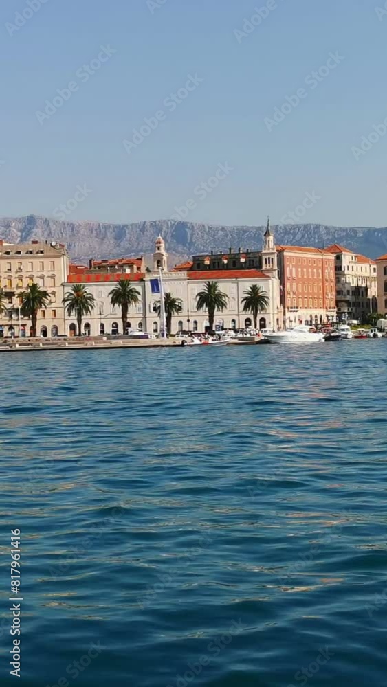 View from the yacht on the embankment of the city of Split on a sunny summer day. Vertical Video View from the yacht on the embankment of the city of Split on a sunny summer day. Vertical Video