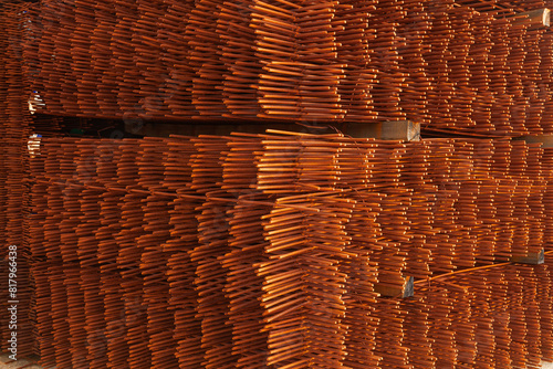 Stacked packs of stored rusty fittings in a warehouse.