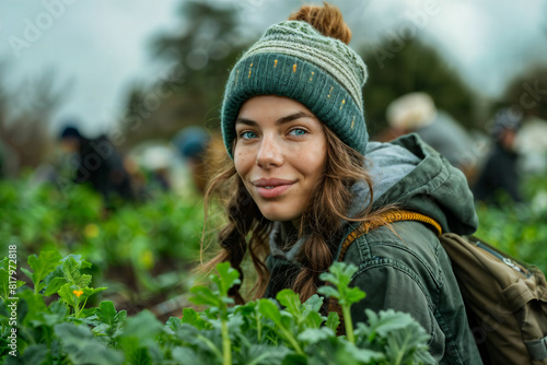 Young Woman Volunteering in Community Garden in Winter