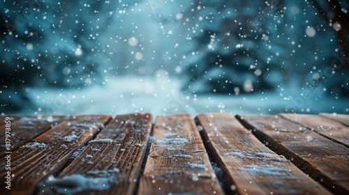 Empty wooden table top for product display, presentation stage. Snowy winter landscape background.