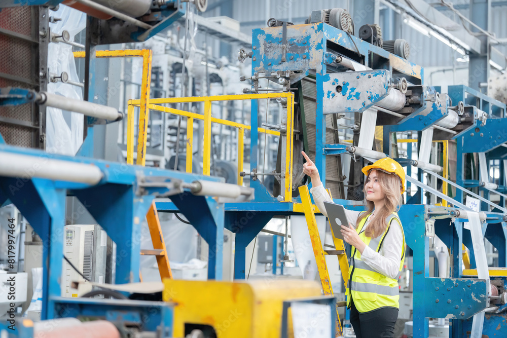 As a key member of the management team, the female engineer brings a unique perspective to the industrial factory's operations, ensuring that machinery functions optimally.