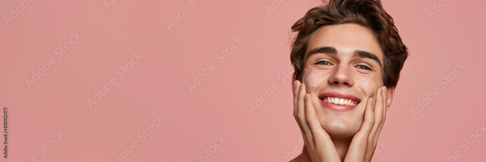 Young man smiling with hands on face Young man smiling with hands on face