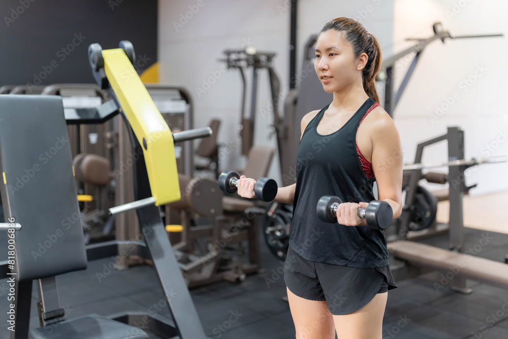 Asian women exercise in gyms. Appearance and health concepts, as well as muscle building. Body care Asian women exercise in gyms. Appearance and health concepts, as well as muscle building. Body care