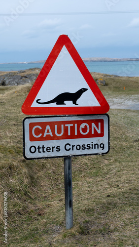 A road sign for wildlife, Caution Otters Crossing in the Outer Hebrides of Western Scotland