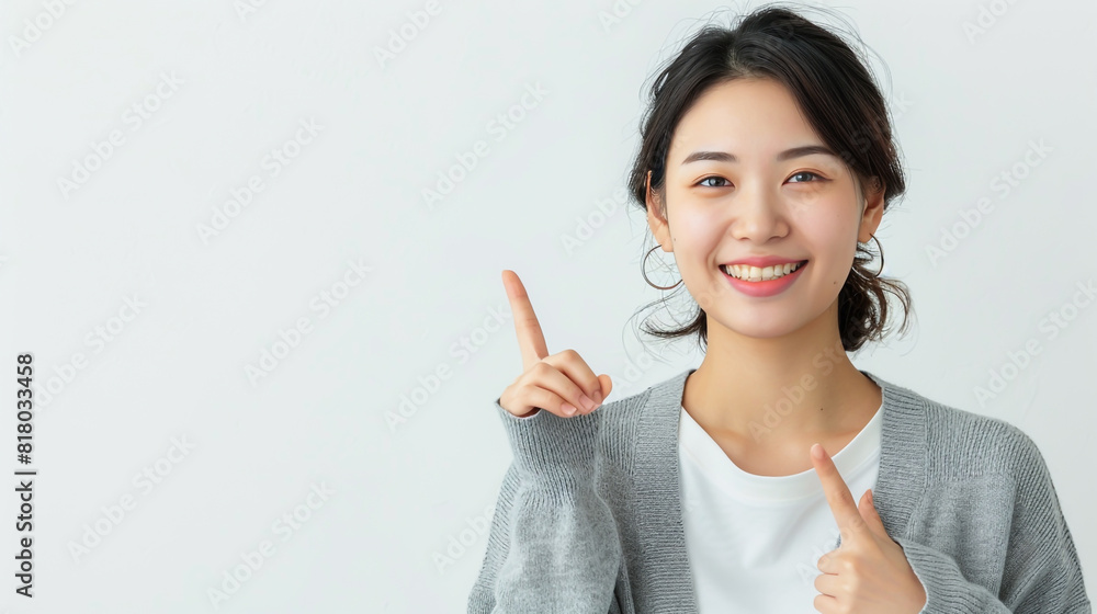 Woman smiling and pointing up something Woman smiling and pointing up something