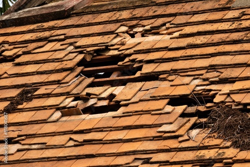 A damaged roof with a hole from Heavy rain storm