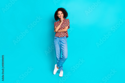 Photo of minded girl standing touch fingers chin isolated cyan color background