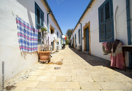 Fototapeta Naklejka Na Ścianę i Meble -  Narrow streets of historical Samanbahce houses in Lefkosa Cyprus in sunny day.