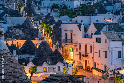 Trulli of Alberobello, Puglia, Italy. town of Alberobello with trulli houses among green plants and flowers