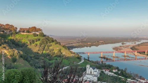 Panorama showing the Castle of Almourol on hill in Santarem aerial timelapse. A medieval castle atop the islet of Almourol in the middle of the Tagus River with bridge over it. Portugal photo