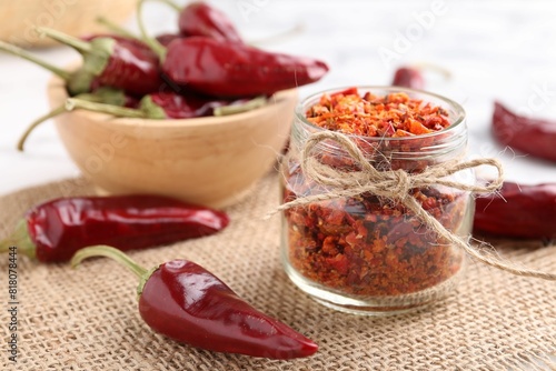 Chili pepper flakes and pods on table
