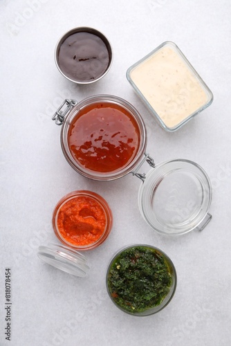 Different marinades on light table, flat lay