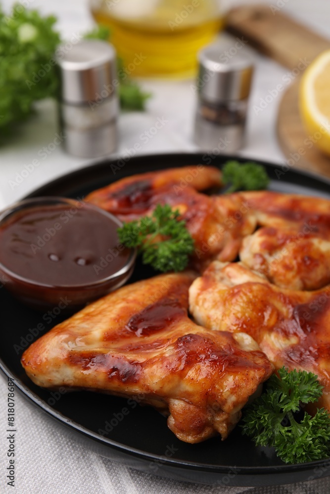 Fototapeta premium Fresh marinade and chicken wings on table, closeup