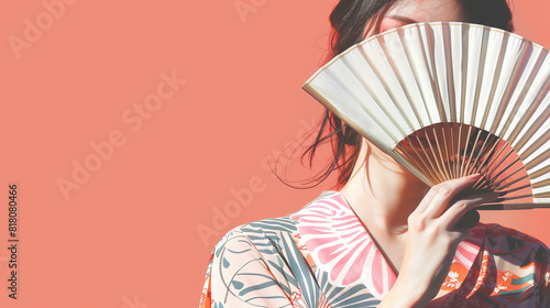 Summer background of a woman in yukata and a fan photo