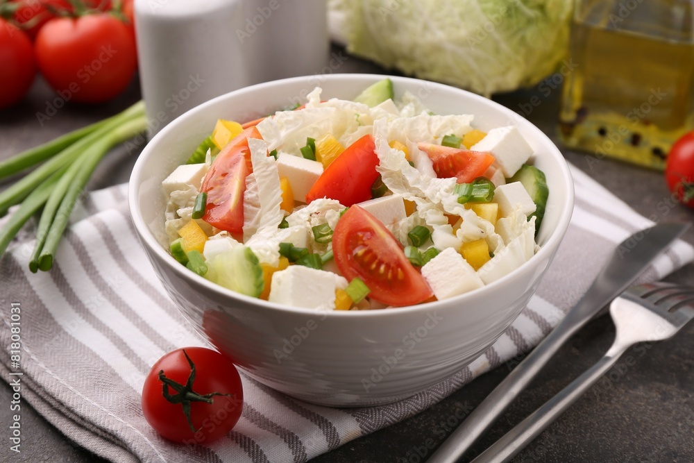 Tasty salad with Chinese cabbage served on grey table, closeup Tasty salad with Chinese cabbage served on grey table, closeup
