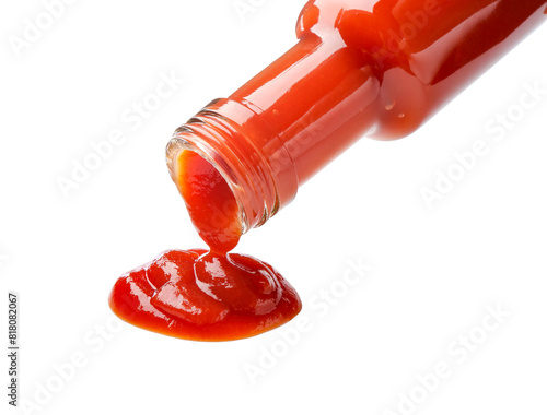 Pouring tasty ketchup from bottle isolated on white. Tomato sauce