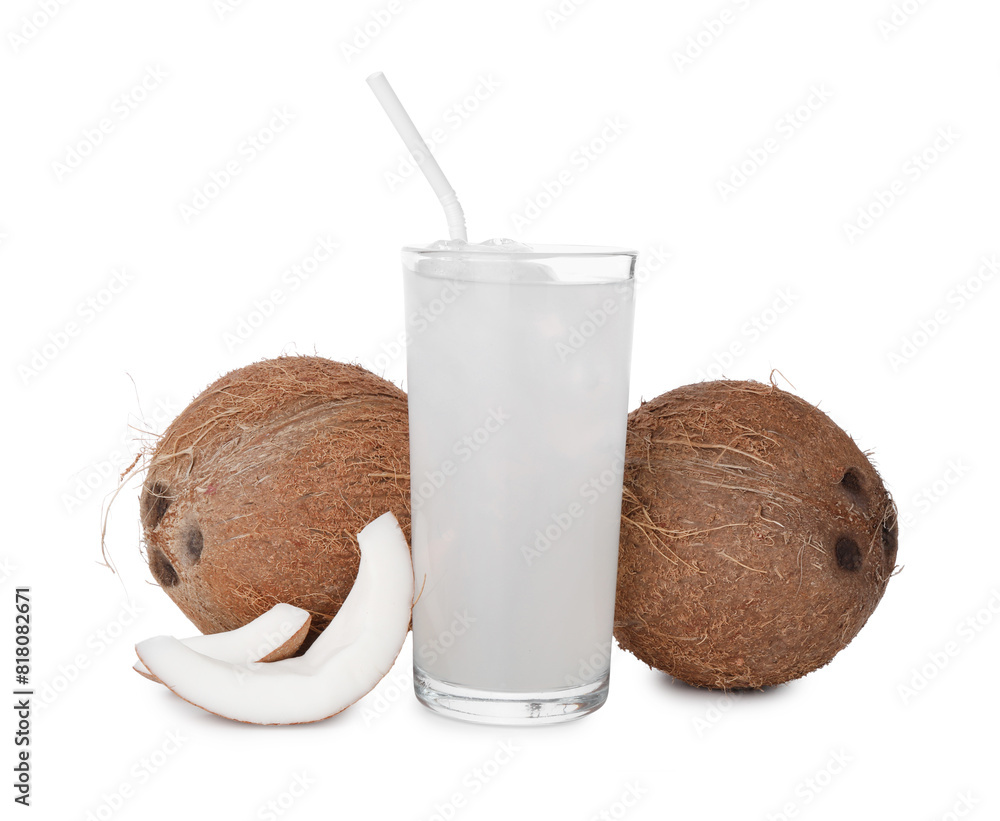 Glass of coconut water, ice cubes and nuts isolated on white Glass of coconut water, ice cubes and nuts isolated on white