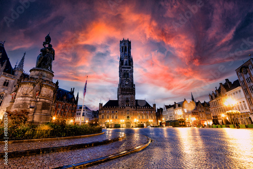 Bruges at sunset. The Chocolate City medieval old town in Flanders in Belgium Northern Europe. Tourist town with ancient gothic towers. architecture building, canals, cobbled alleys and flowers photo