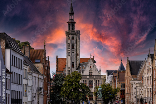 Bruges at sunset. The Chocolate City medieval old town in Flanders in Belgium Northern Europe. Tourist town with ancient gothic towers. architecture building, canals, cobbled alleys and flowers photo