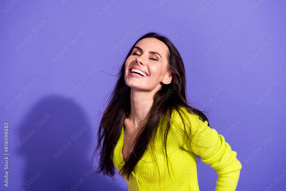 Photo of positive cheerful lovely girl wear trendy clothes closed eyes isolated on purple color background Photo of positive cheerful lovely girl wear trendy clothes closed eyes isolated on purple color background