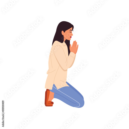 young girl kneels and prays