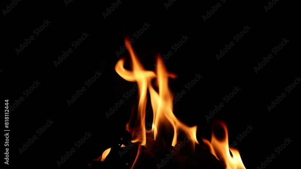 Fire texture on a black background. The fire pattern at night has its own impression. Fire texture on a black background. The fire pattern at night has its own impression.