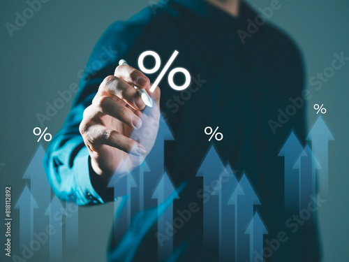 Businessman selects arrow and percentage icon Interest rates and dividends With graph indicators for investment growth business financial investment Business growth, revenue, marketing and profits