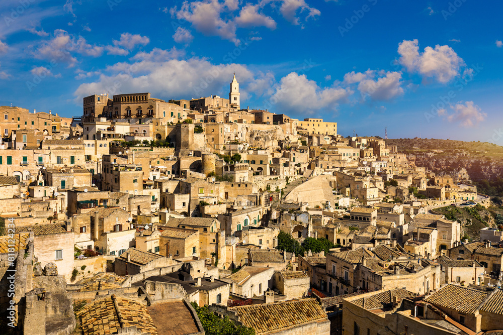 Obraz premium Panoramic view of the ancient town of Matera (Sassi di Matera) in a beautiful autumn day, Basilicata, southern Italy. Stunning view of the village of Matera. Matera is a city on a rocky outcrop.