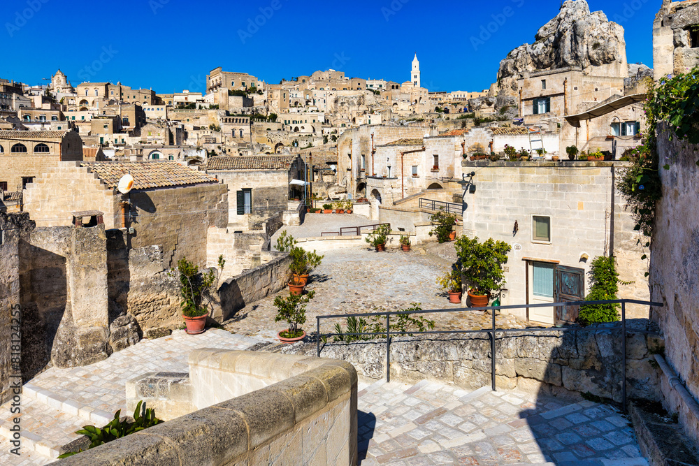 Panoramic view of the ancient town of Matera (Sassi di Matera) in a beautiful autumn day, Basilicata, southern Italy. Stunning view of the village of Matera. Matera is a city on a rocky outcrop. Panoramic view of the ancient town of Matera (Sassi di Matera) in a beautiful autumn day, Basilicata, southern Italy. Stunning view of the village of Matera. Matera is a city on a rocky outcrop.