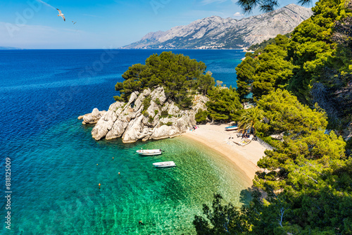 Fototapeta Naklejka Na Ścianę i Meble -  Amazing aerial view of the beautiful Podrace beach in Brela, Makarska Riviera, Croatia. Aerial view of Podrace beach and waterfront on Makarska riviera, Brela, Dalmatia region of Croatia.