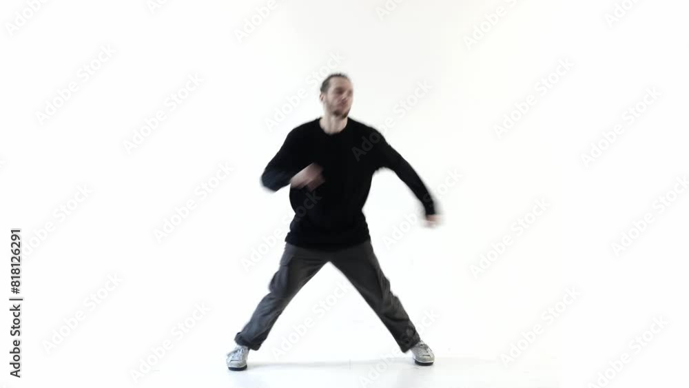 Male dancer dances hip-hop showing impressive legs moves Male dancer dances hip-hop showing impressive legs moves