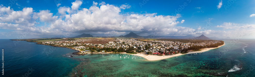 Beach of Flic en Flac with beautiful peaks in the background, Mauritius. Beautiful Mauritius Island with gorgeous beach Flic en Flac, aerial view from drone. Flic en Flac Beach, Mauritius Island.