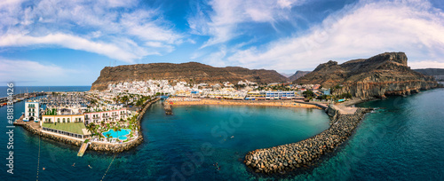Puerto de Mogan with the beach in Gran Canaria, Spain. Favorite vacation place for tourists and locals on island. Harbor in Puerto de Mogan and Playa Mogan on Grand Canary Island, Spain. photo