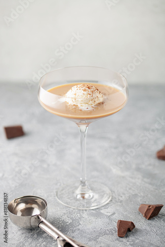 Ice cream ball with irish coffee liqueur. Alcoholic affogato. Summer cocktail.