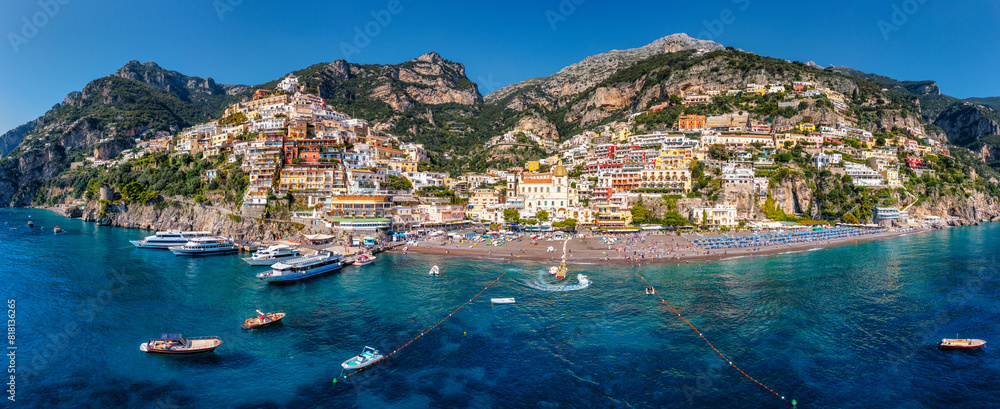 Naklejka premium Aerial view of Positano with comfortable beach and blue sea on Amalfi Coast in Campania, Italy. Positano village on the Amalfi Coast, Salerno, Campania. Beautiful Positano, Amalfi Coast in Campania.