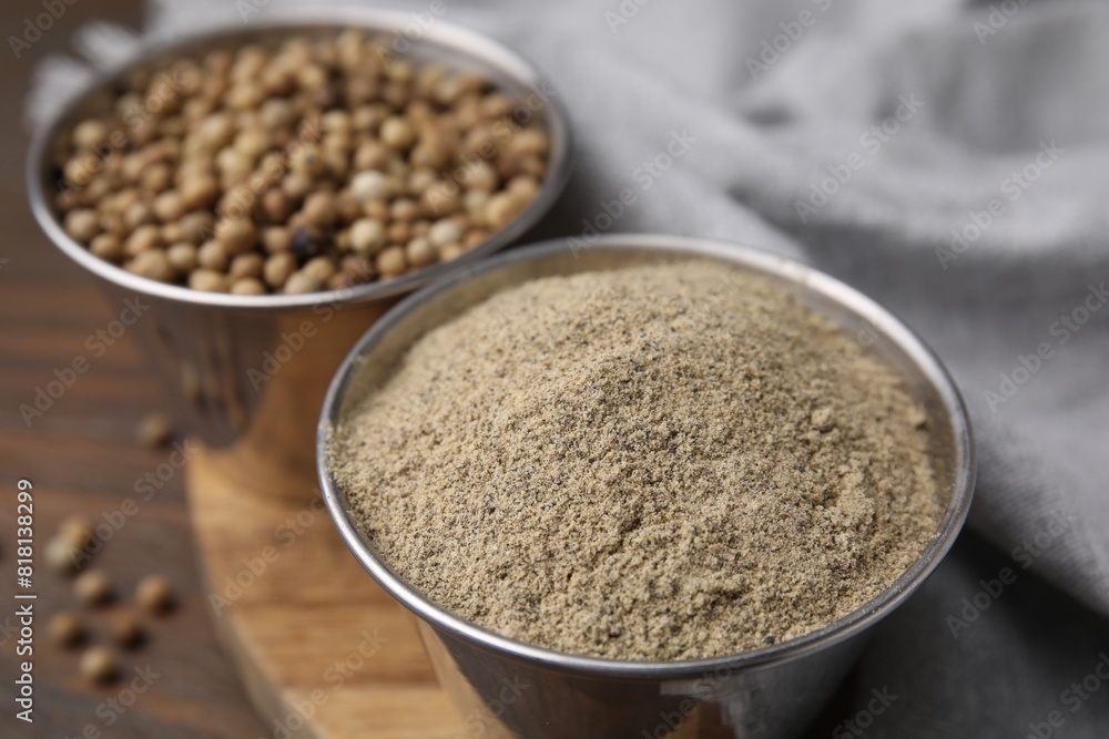 Ground pepper and peppercorns on wooden table, closeup Ground pepper and peppercorns on wooden table, closeup