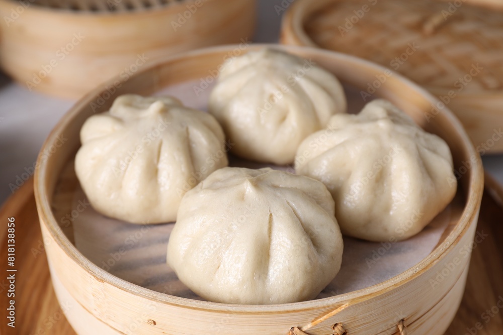 Delicious bao buns (baozi) on table, closeup Delicious bao buns (baozi) on table, closeup