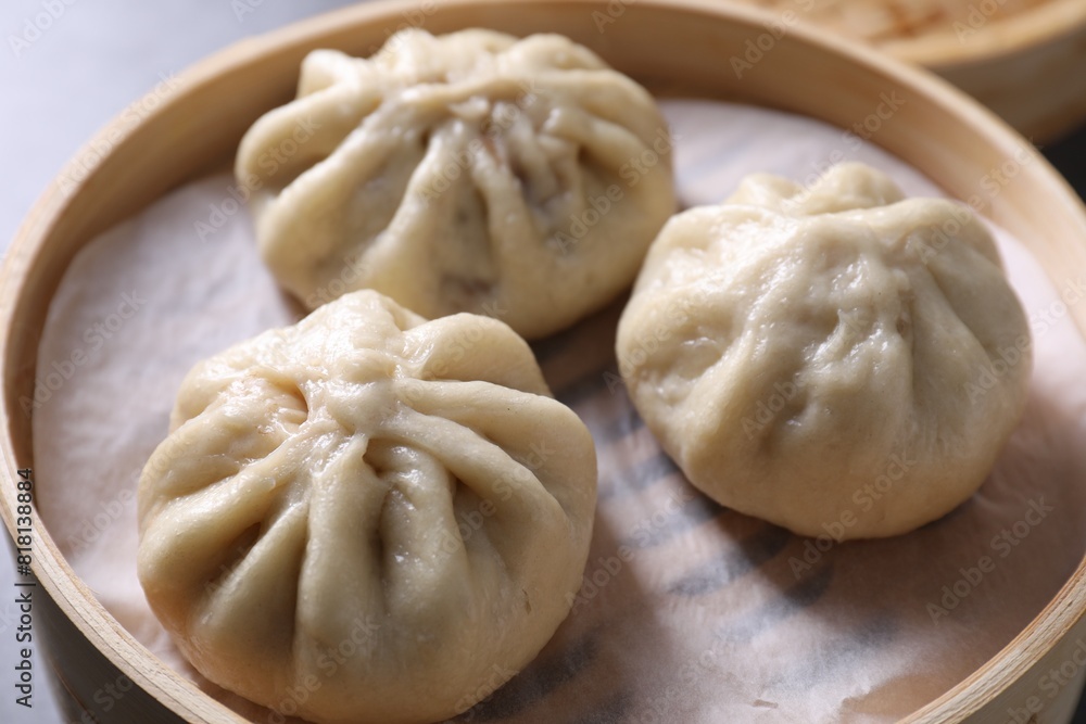 Delicious bao buns (baozi) on table, closeup Delicious bao buns (baozi) on table, closeup