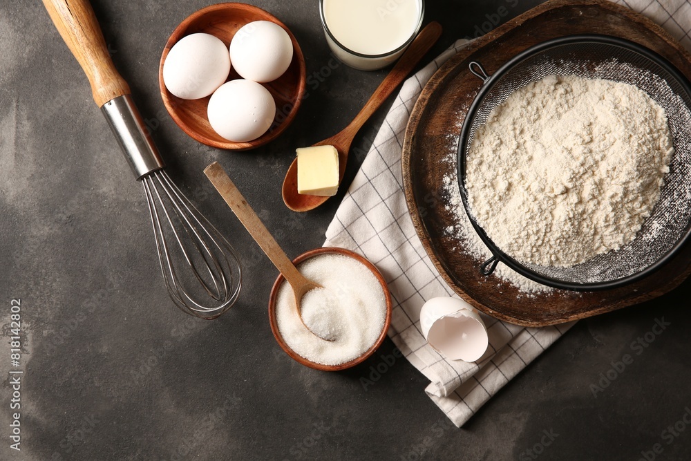 Different ingredients for dough on grey textured table, flat lay Different ingredients for dough on grey textured table, flat lay