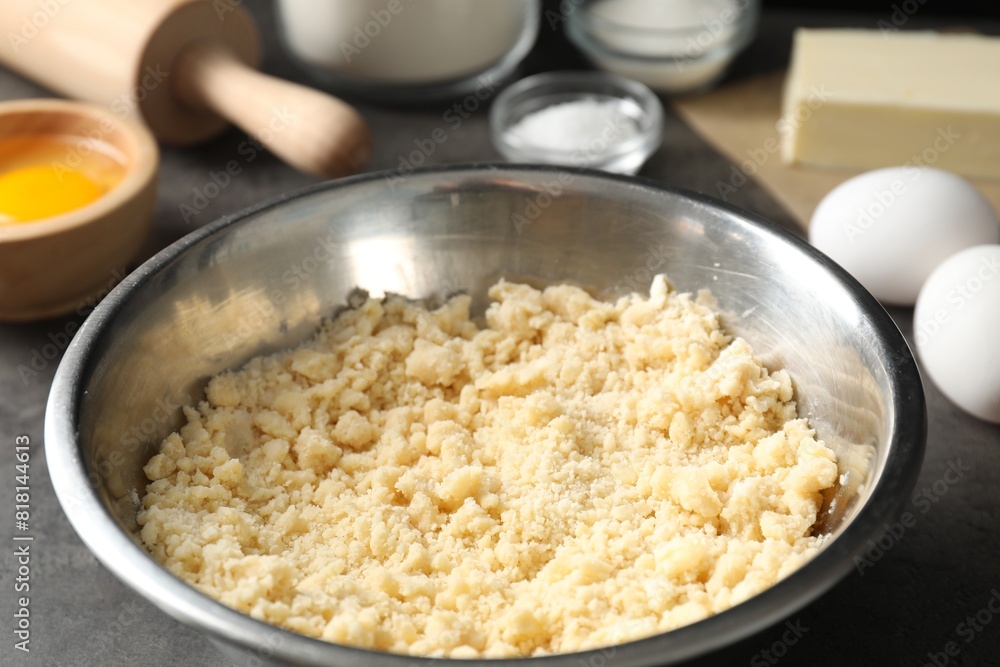 Shortcrust pastry in bowl on grey table, closeup Shortcrust pastry in bowl on grey table, closeup