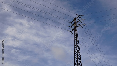 medium voltage metallic electric tower against the sky