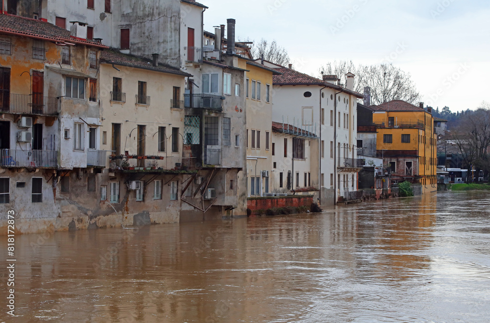 Obraz premium River overflowed during a city flood and the homes of the population lapped by the water