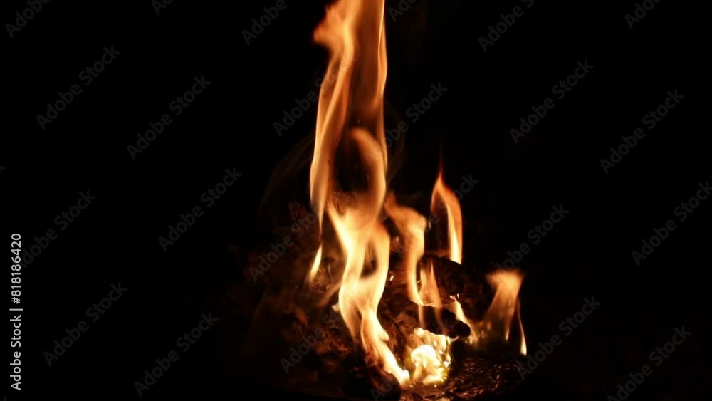 Fire texture on a black background. The fire pattern at night has its own impression. Fire texture on a black background. The fire pattern at night has its own impression.