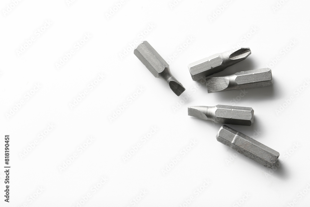 Different screwdriver bits on white background, top view Different screwdriver bits on white background, top view